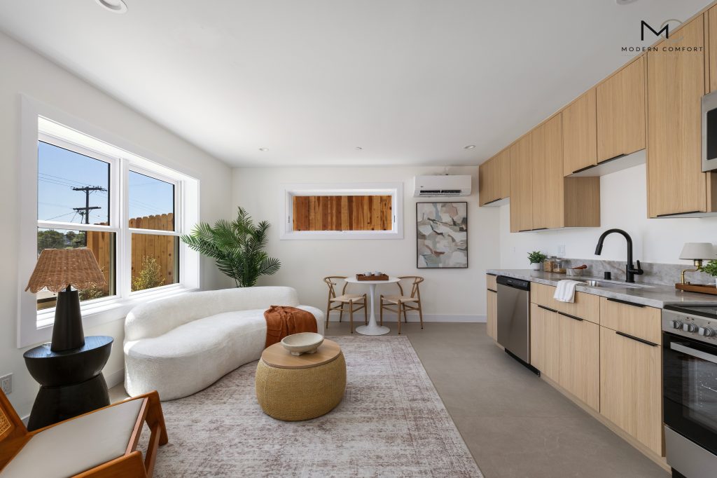 Open-concept ADU living area and kitchen with light wood cabinets
